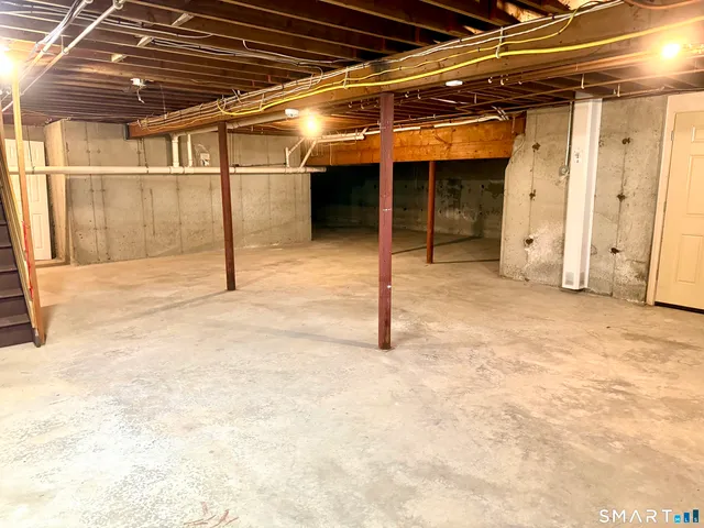 a view of a bedroom with wooden floor and closet