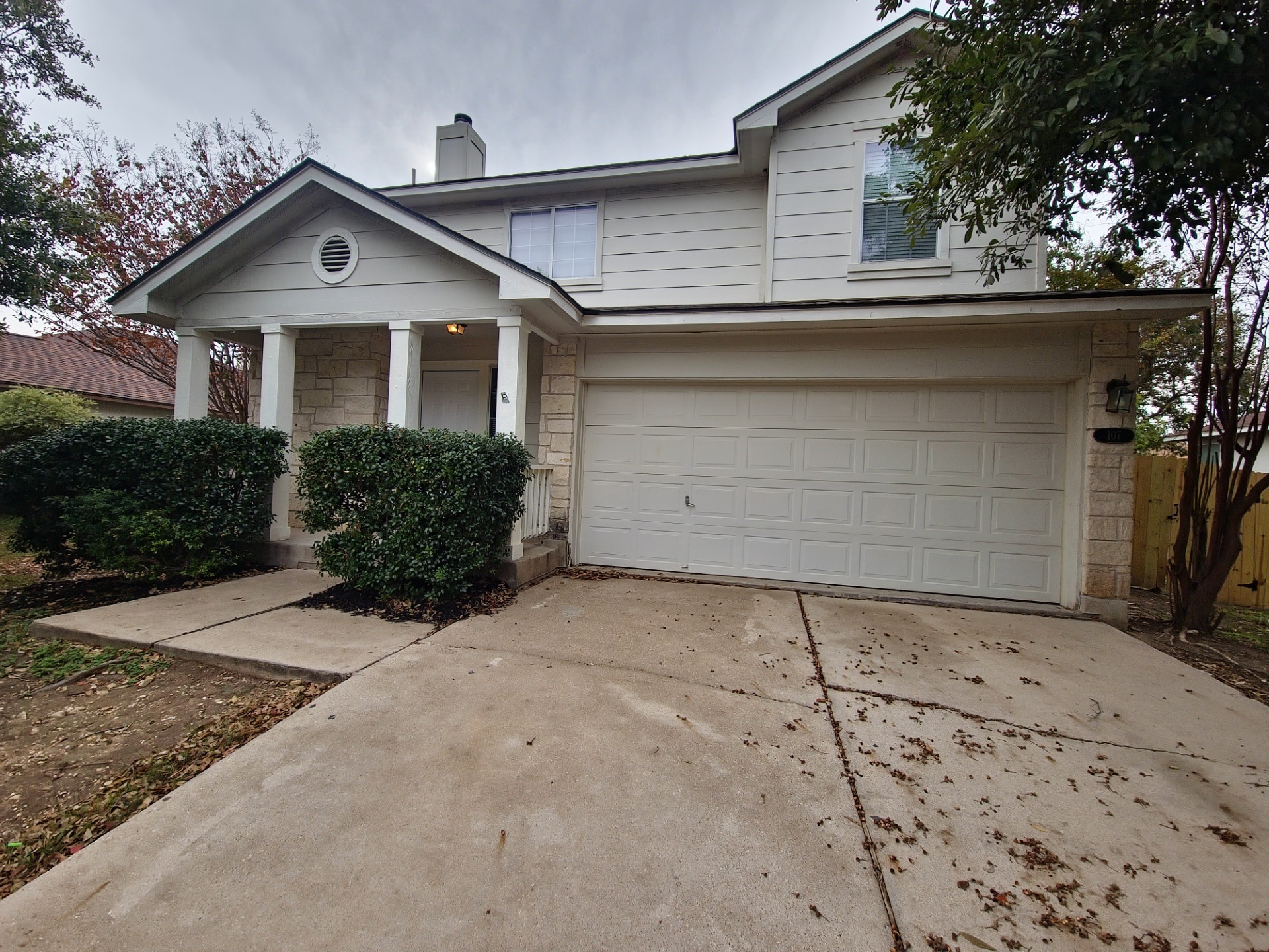 107 Orange Tree Lane Georgetown, TX 78626 - Photo 1 of 1 a front view of a house with a yard and garage