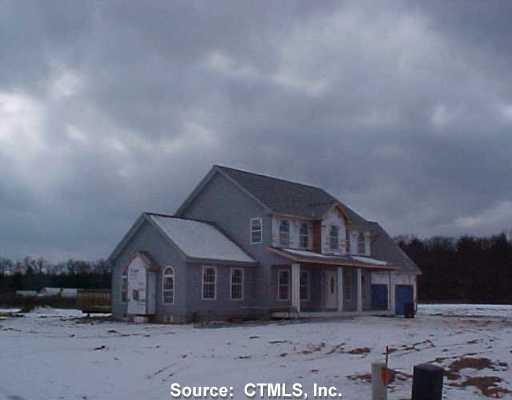 5 Huckleberry Road Windsor, CT 06095 - Photo 1 of 1 a front view of a house with a yard