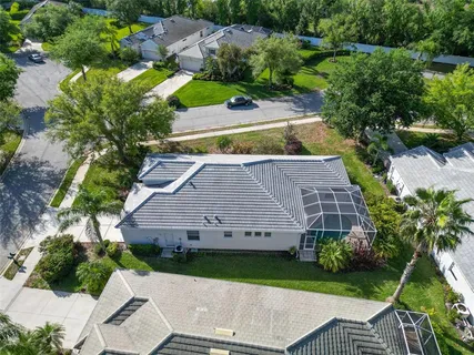 an aerial view of a house with a yard