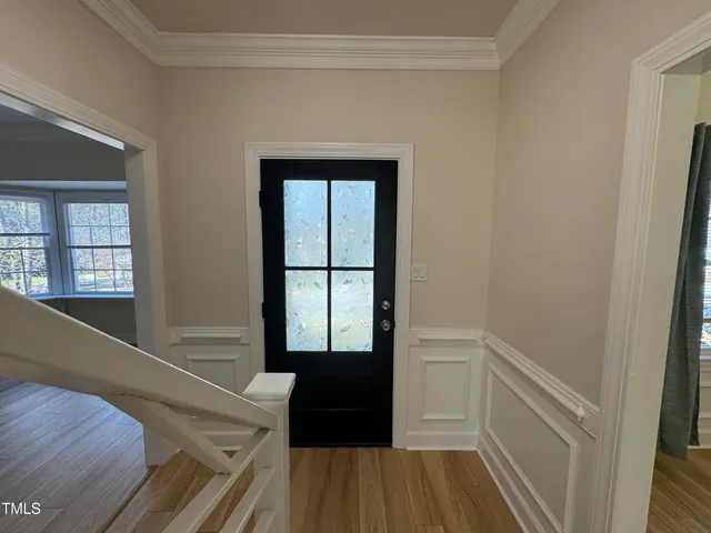 a view of walk in closet with wooden floor