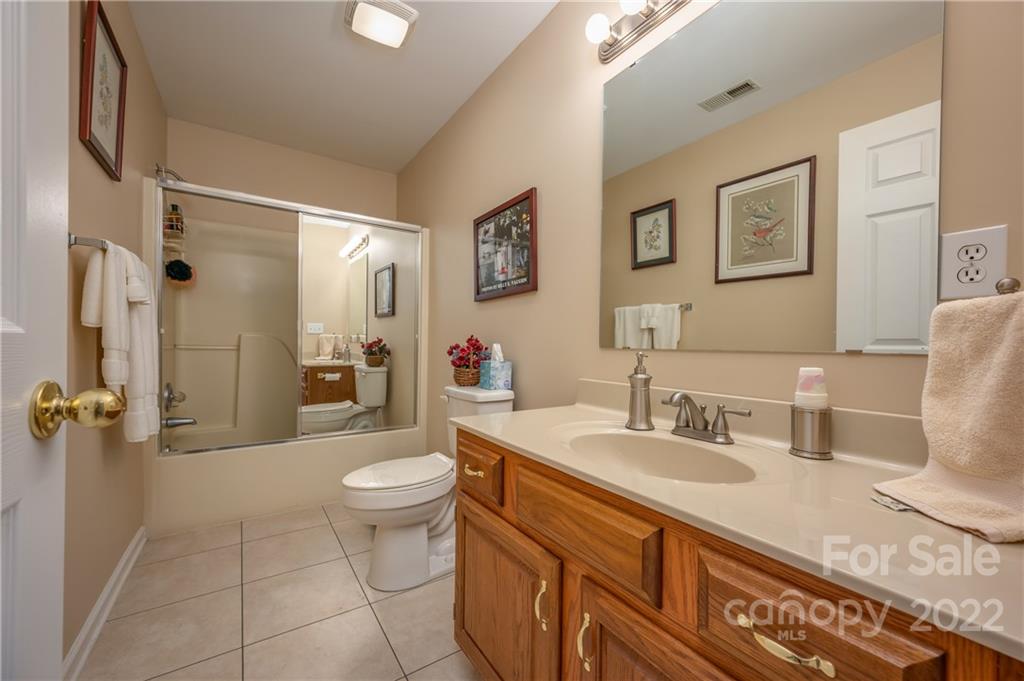 375 General Griffith Circle Rutherfordton, NC 28139 - Photo 11 of 36 a bathroom with a sink a toilet and shower