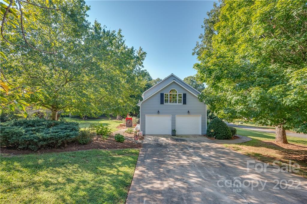 375 General Griffith Circle Rutherfordton, NC 28139 - Photo 2 of 36 a front view of a house with garden