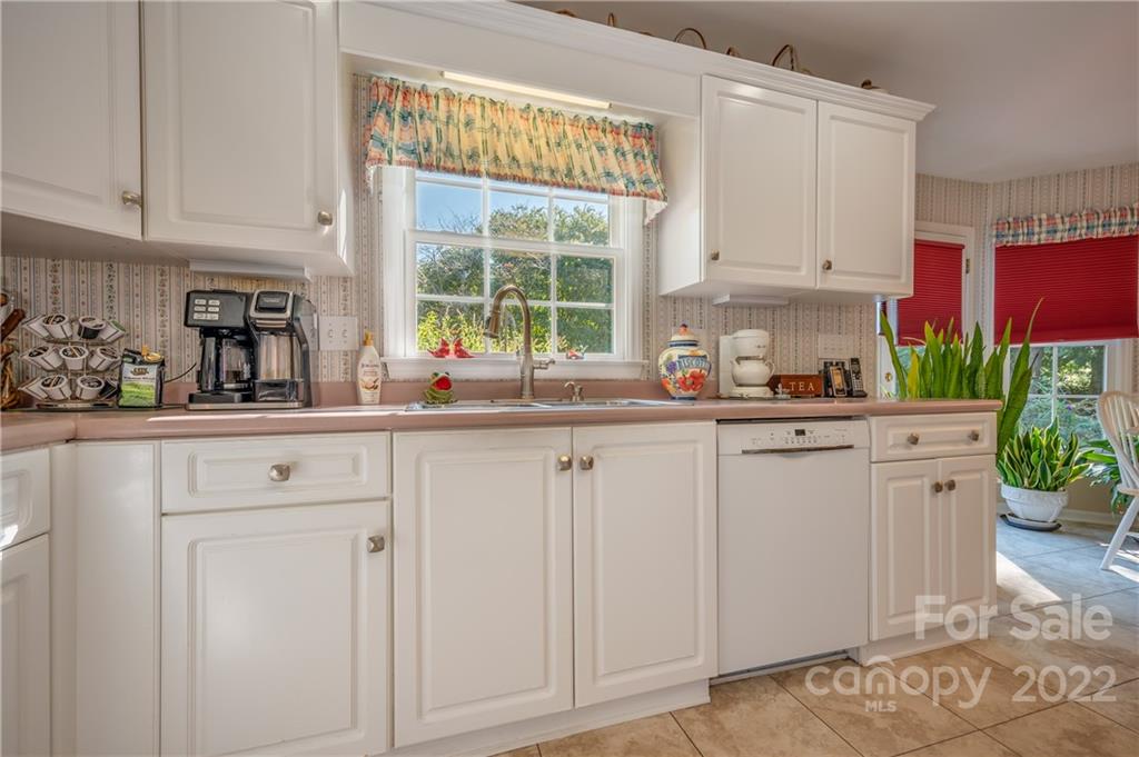 375 General Griffith Circle Rutherfordton, NC 28139 - Photo 21 of 36 a kitchen with white cabinets and window