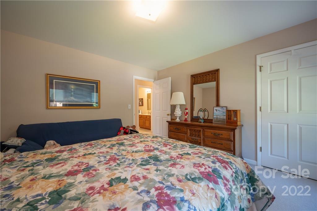 375 General Griffith Circle Rutherfordton, NC 28139 - Photo 25 of 36 a bedroom with a bed and a dresser in it