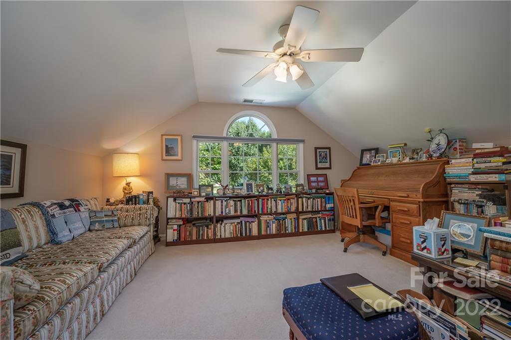375 General Griffith Circle Rutherfordton, NC 28139 - Photo 27 of 36 a bedroom with furniture and a chandelier