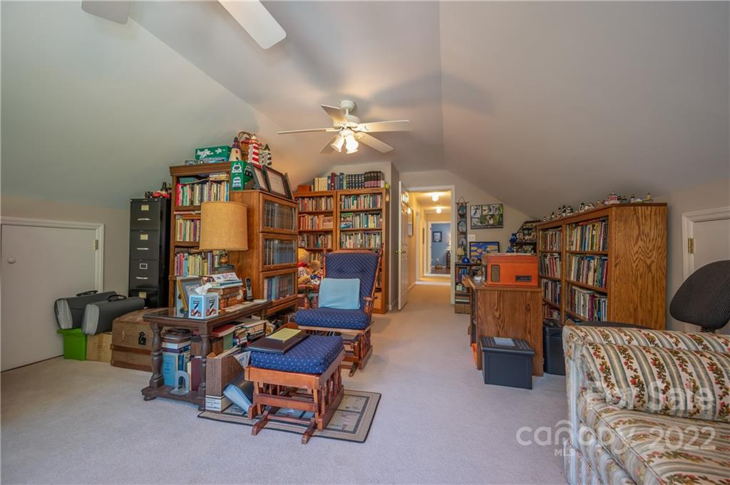 375 General Griffith Circle Rutherfordton, NC 28139 - Photo 28 of 36 a living room with furniture and a chandelier