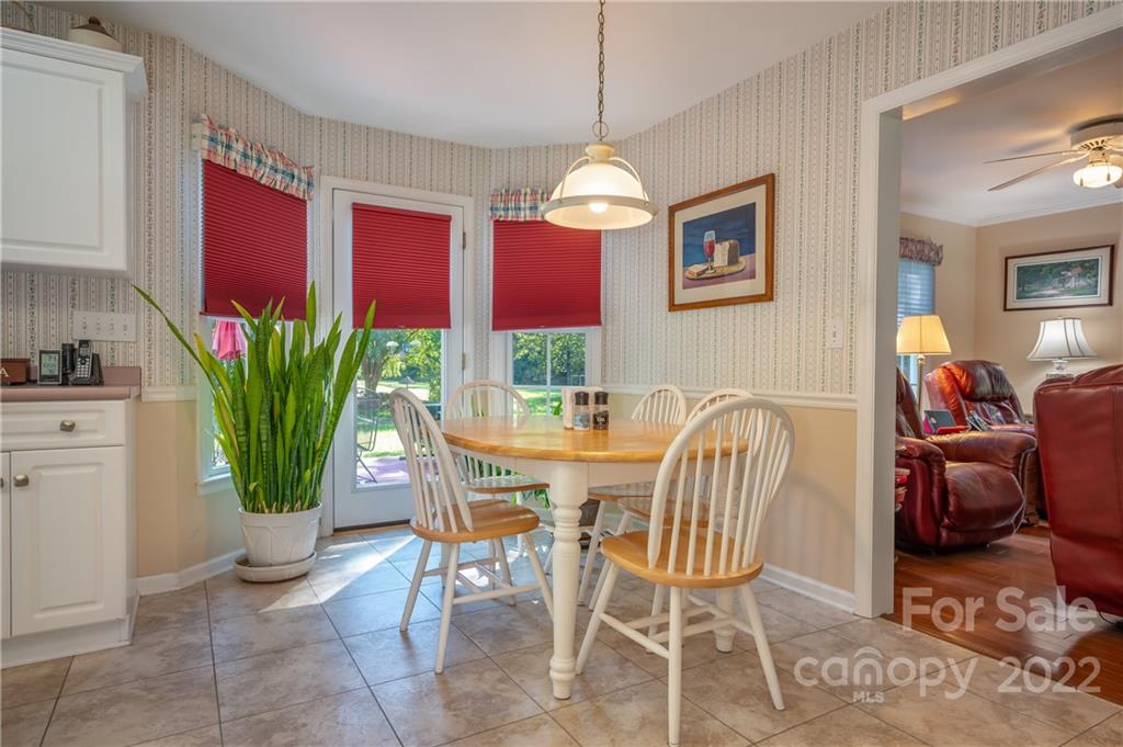 375 General Griffith Circle Rutherfordton, NC 28139 - Photo 6 of 36 a view of a dining room with furniture window and wooden floor