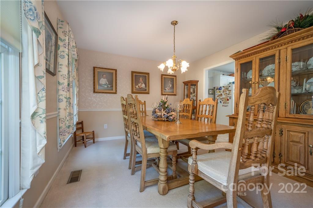 375 General Griffith Circle Rutherfordton, NC 28139 - Photo 7 of 36 a view of a dining room with furniture and chandelier