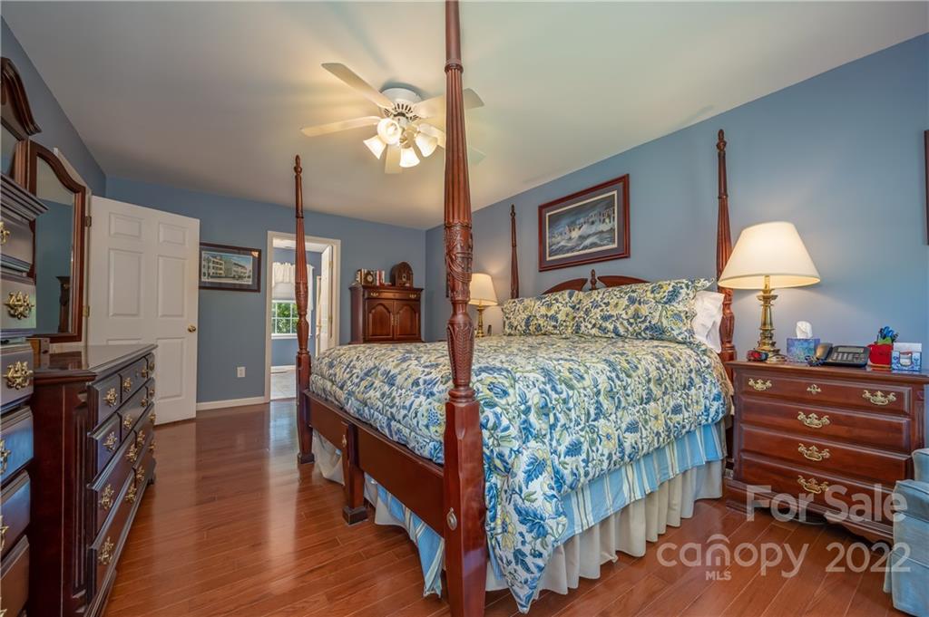 375 General Griffith Circle Rutherfordton, NC 28139 - Photo 8 of 36 a bedroom with a bed and a chandelier