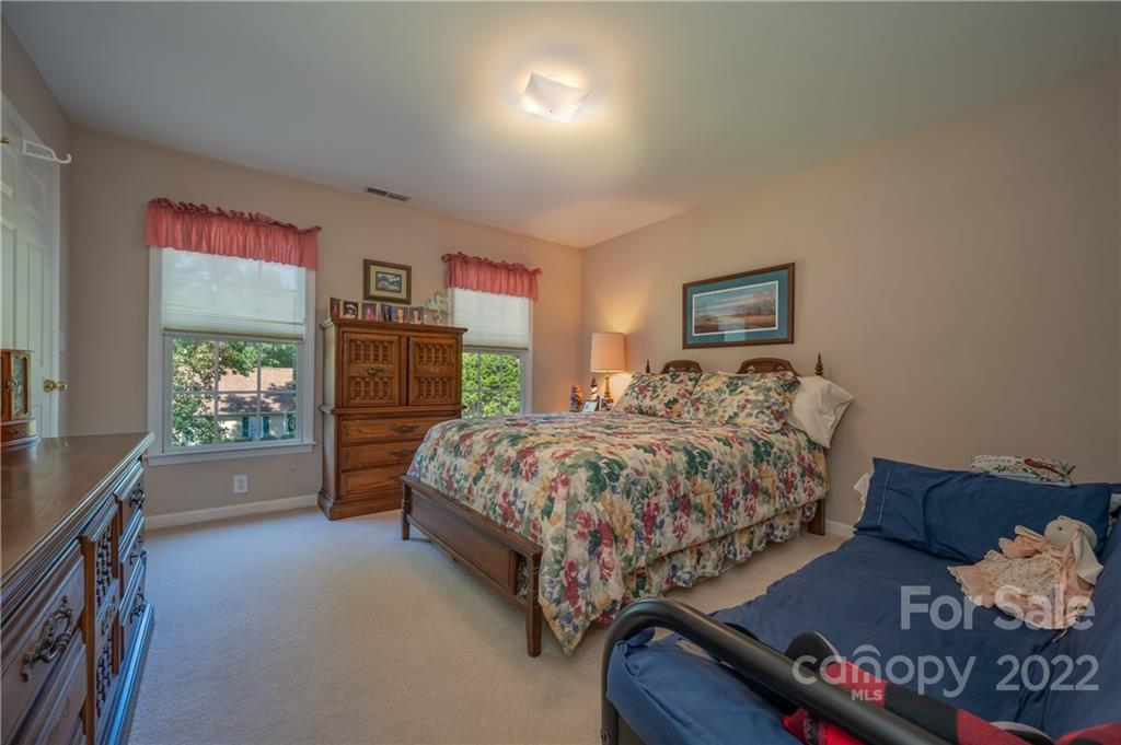 375 General Griffith Circle Rutherfordton, NC 28139 - Photo 10 of 36 a bed sitting in a spacious bedroom next to a window