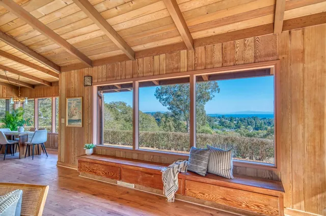 a kitchen with stainless steel appliances granite countertop a sink a stove and a wooden floors