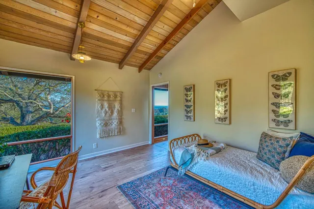 a spacious bathroom with a toilet a sink and a mirror