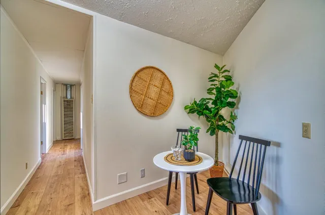 a view of a house with a yard and pathway