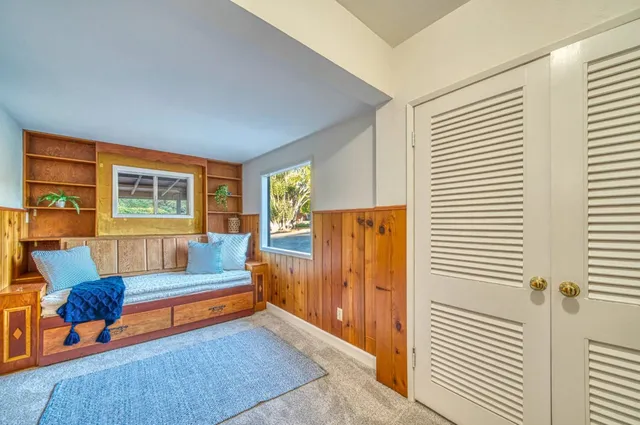 a view of a house with a yard and sitting area