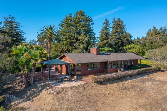 an aerial view of house and yard