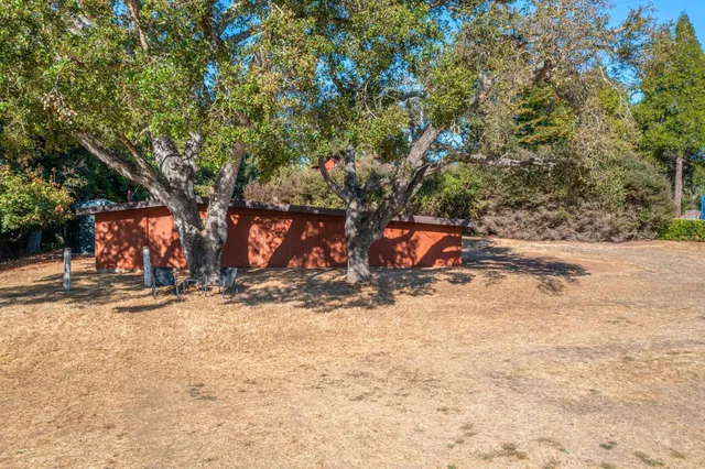 a backyard of a house with lots of green space