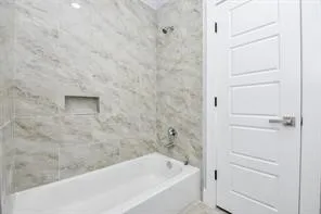 a bathroom with a bathtub