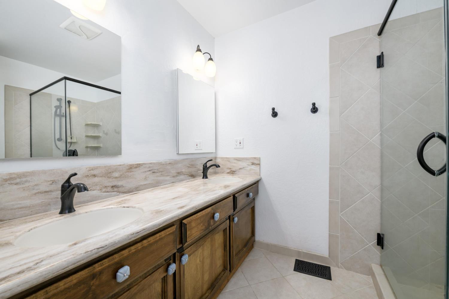2921 Miller Way Placerville, CA 95667 - Photo 15 of 29 a bathroom with a sink and a mirror