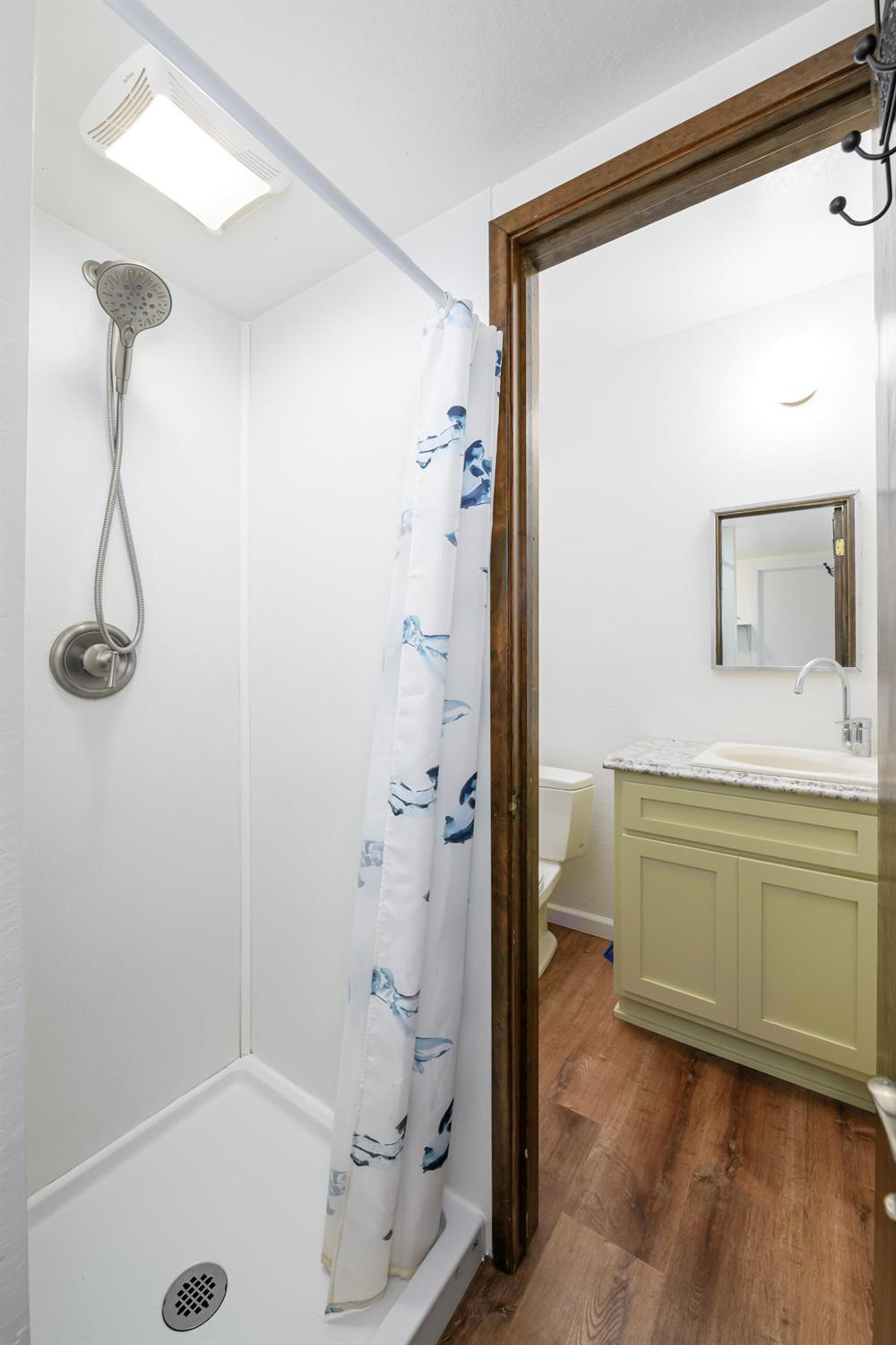 2921 Miller Way Placerville, CA 95667 - Photo 19 of 29 a bathroom with a tub sink and mirror