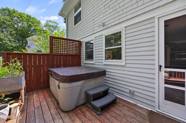 a view of a deck with wooden floor and a yard