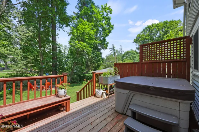 a wooden bench sitting on top of a wooden deck