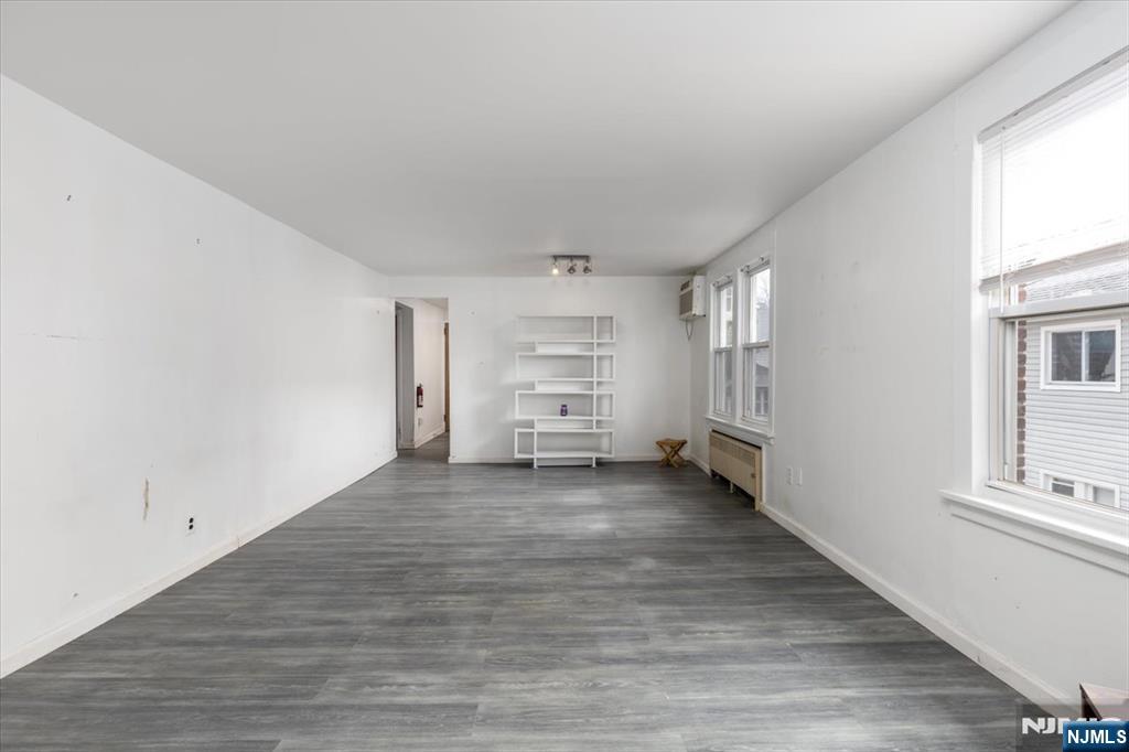 7 Delafield Avenue Rutherford, NJ 07070 - Photo 18 of 30 a view of a room with wooden floor closet and windows