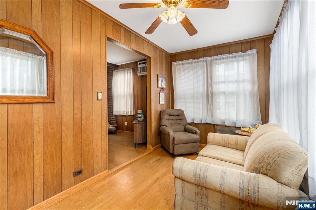 7 Delafield Avenue Rutherford, NJ 07070 - Photo 2 of 30 a living room with furniture and a window