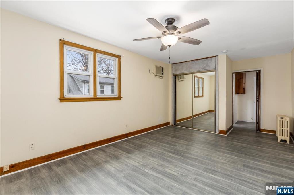 7 Delafield Avenue Rutherford, NJ 07070 - Photo 27 of 30 a view of an empty room with wooden floor and a ceiling fan
