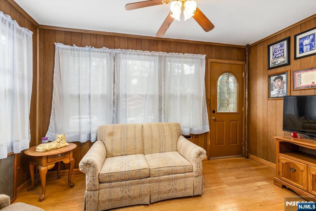 7 Delafield Avenue Rutherford, NJ 07070 - Photo 3 of 30 a living room with furniture and a flat screen tv