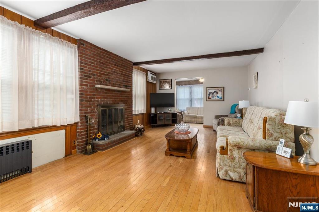 7 Delafield Avenue Rutherford, NJ 07070 - Photo 5 of 30 a living room with furniture and a fireplace