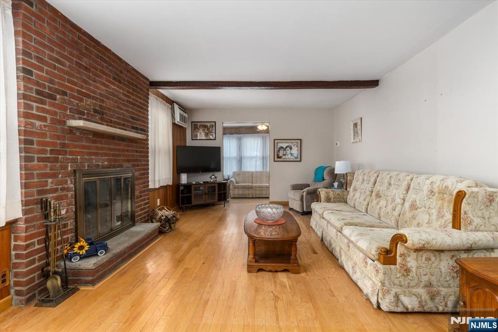 7 Delafield Avenue Rutherford, NJ 07070 - Photo 6 of 30 a living room with furniture and a fireplace