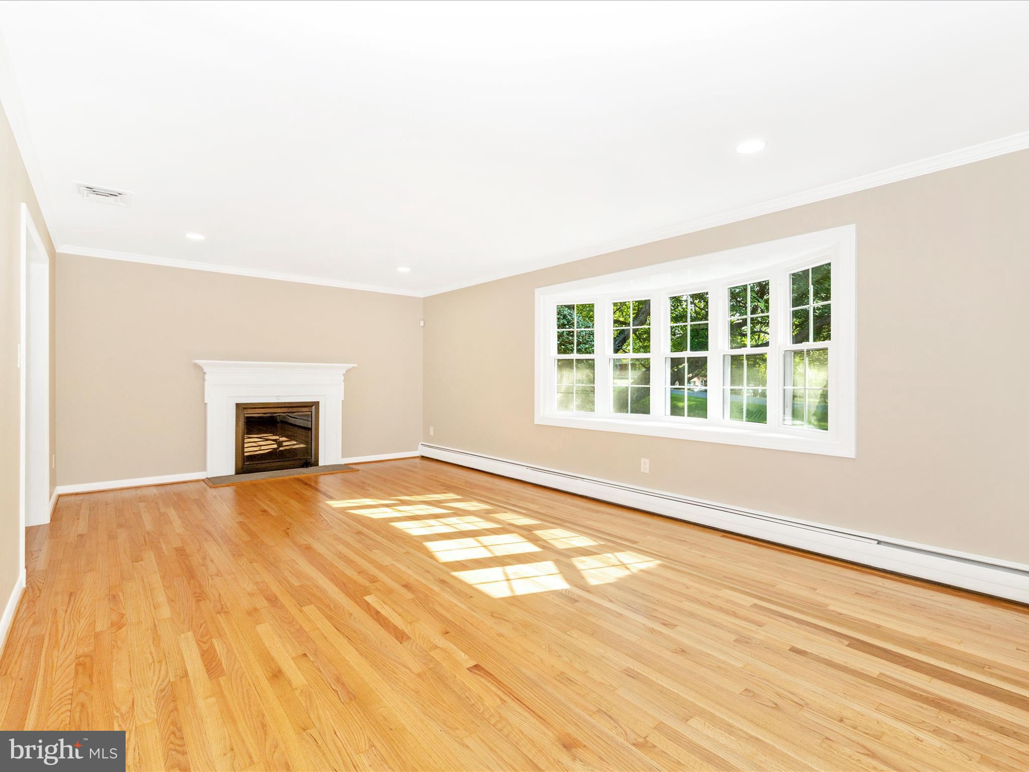 3930 Chatham Road Ellicott City, MD 21042 - Photo 13 of 51 a view of an empty room with a window and fireplace