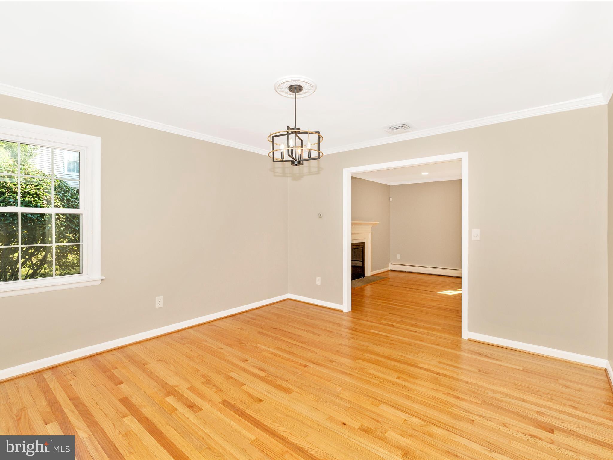 3930 Chatham Road Ellicott City, MD 21042 - Photo 16 of 51 a view of empty room with wooden floor and fan