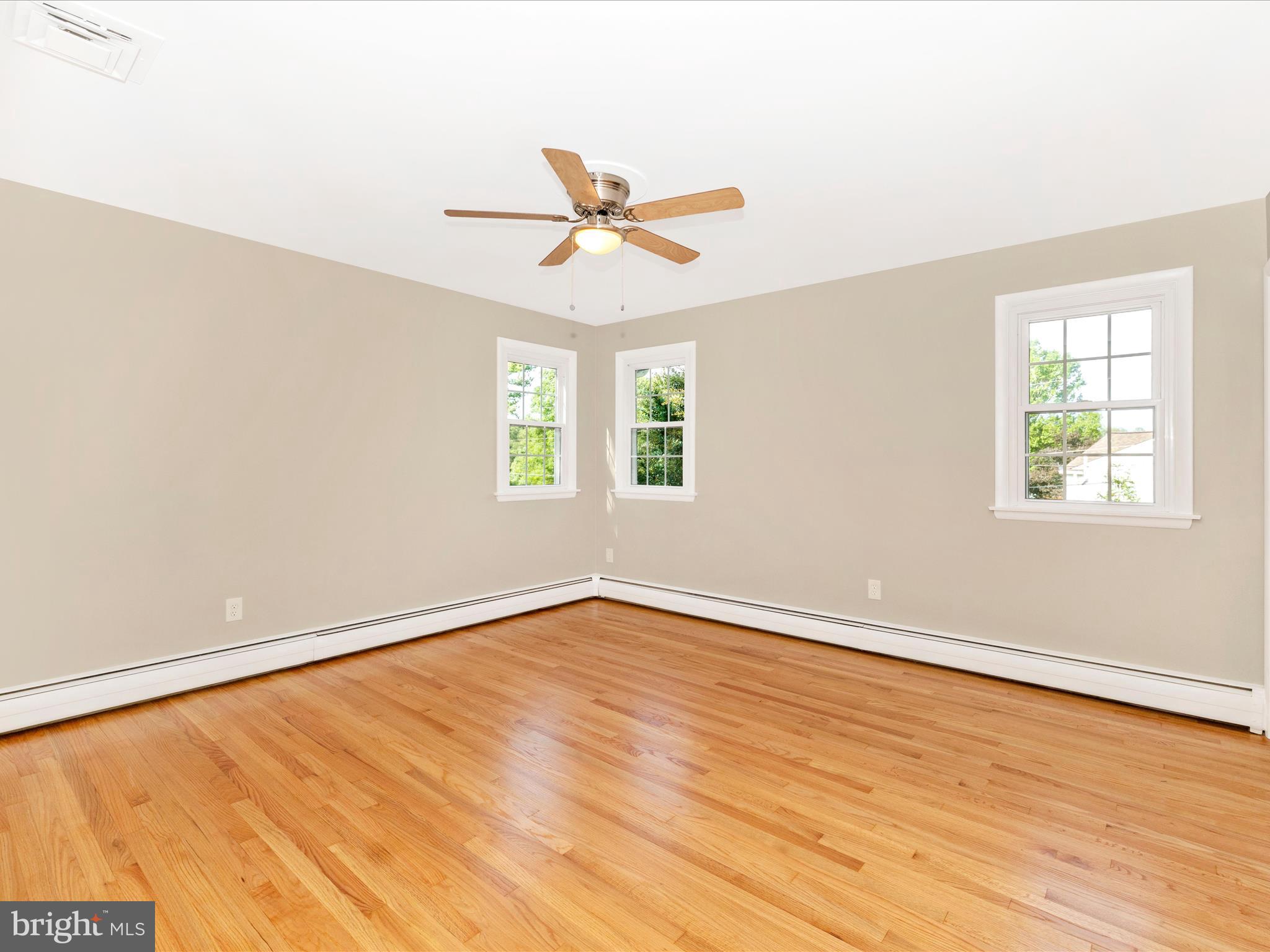 3930 Chatham Road Ellicott City, MD 21042 - Photo 21 of 51 wooden floor in an empty room with a window