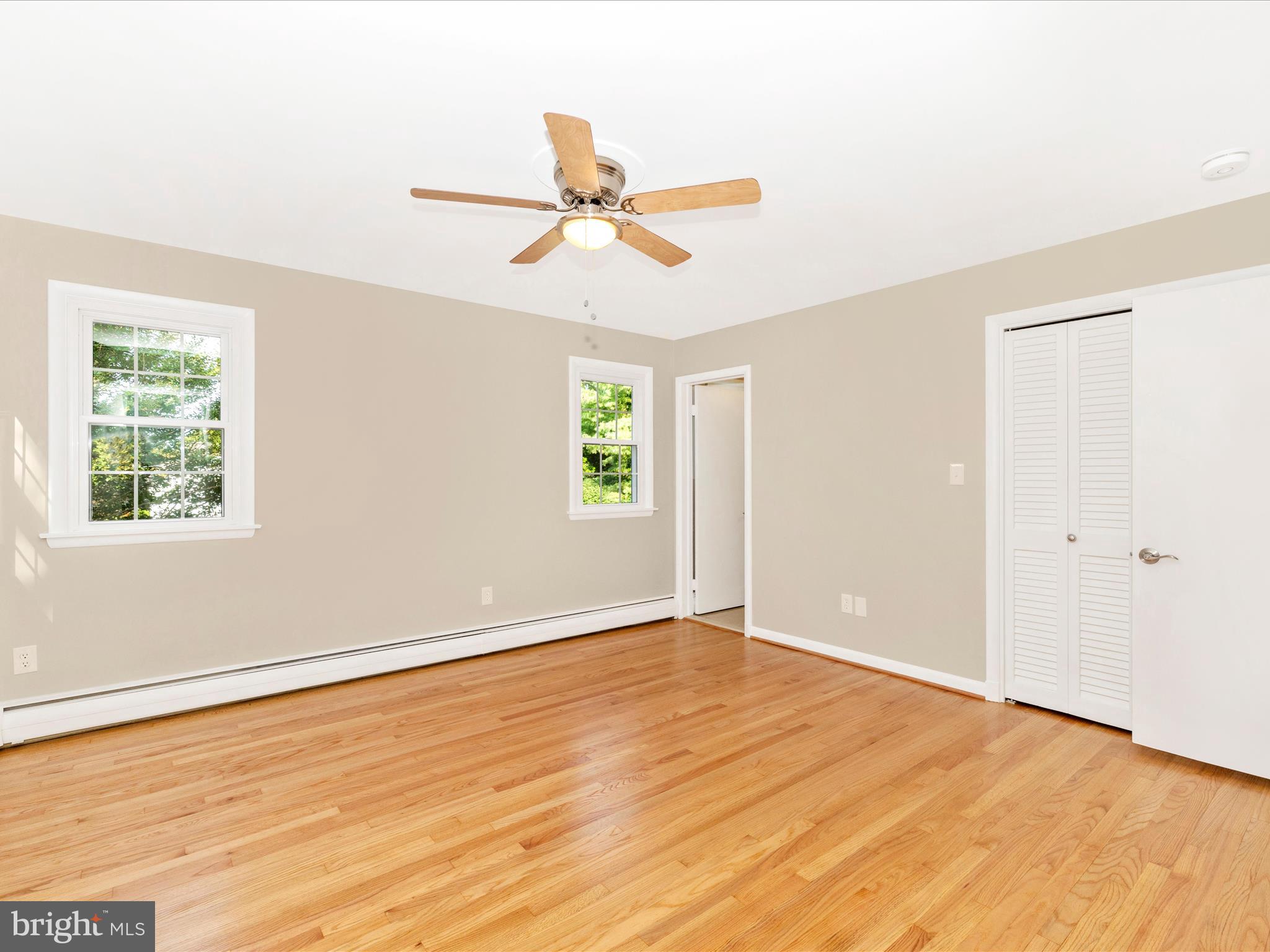 3930 Chatham Road Ellicott City, MD 21042 - Photo 22 of 51 a view of empty room with wooden floor and fan