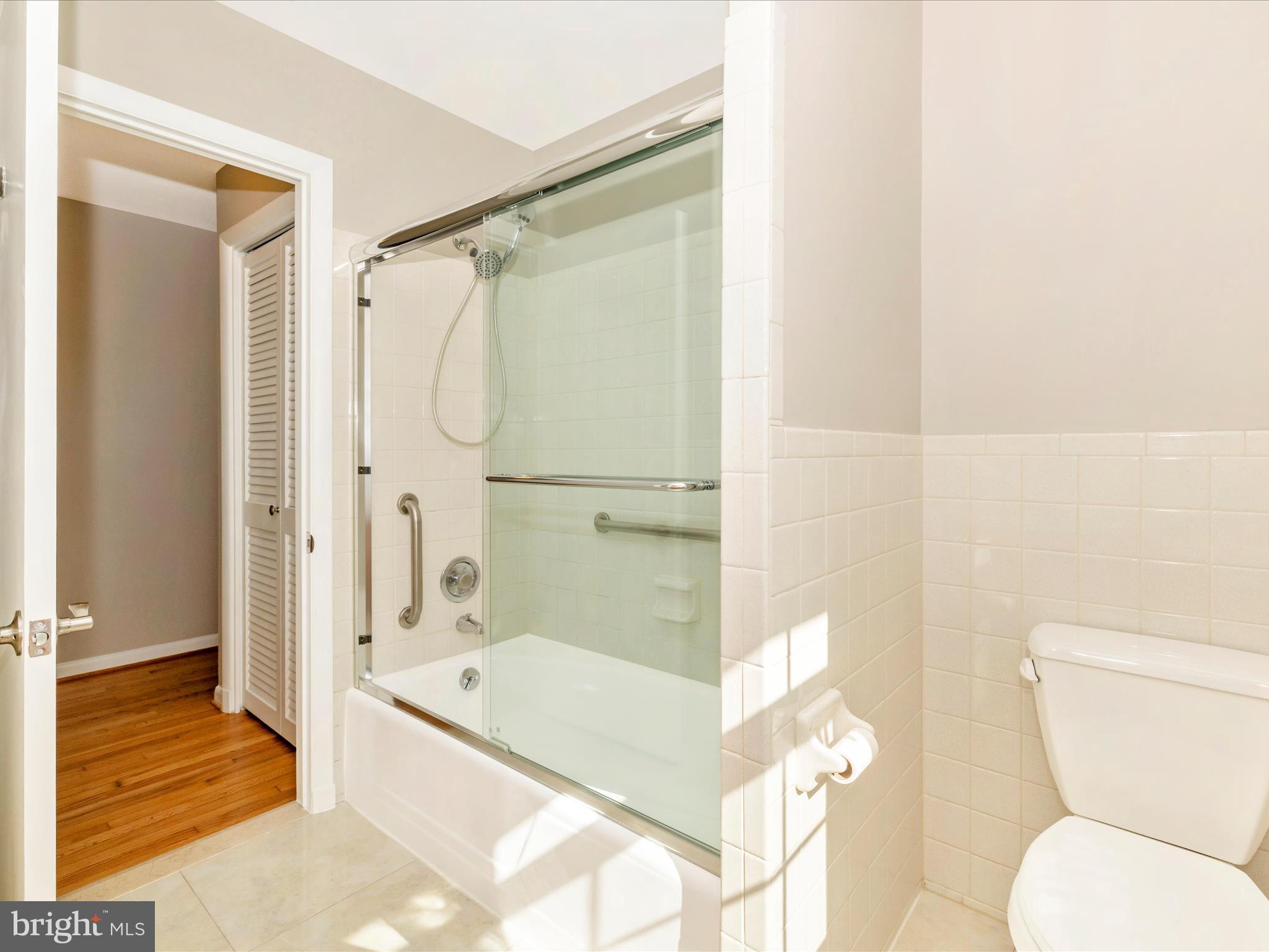 3930 Chatham Road Ellicott City, MD 21042 - Photo 33 of 51 a bathroom with a granite countertop bathtub shower and toilet