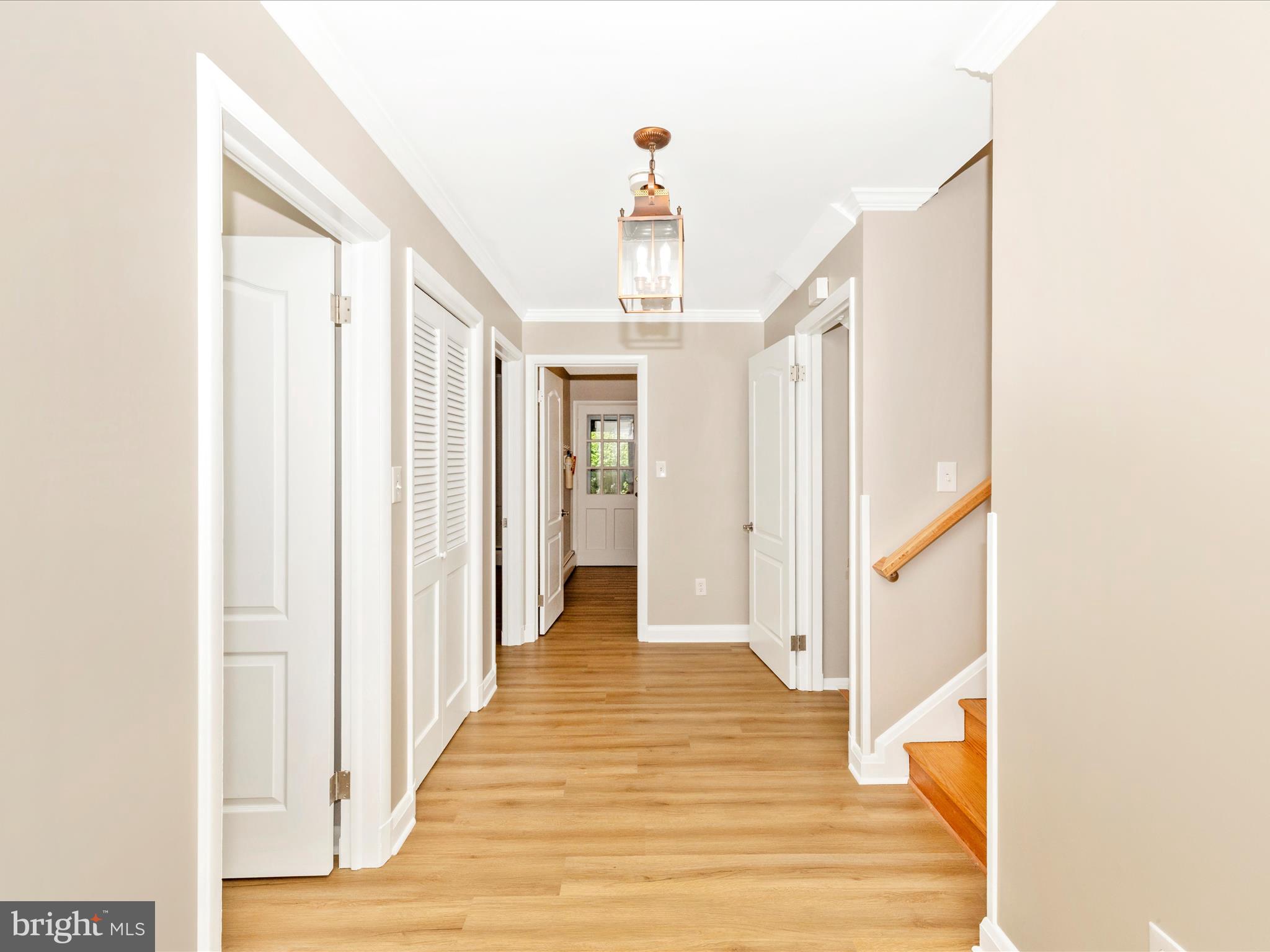 3930 Chatham Road Ellicott City, MD 21042 - Photo 4 of 51 a view of a hallway with wooden floor and staircase