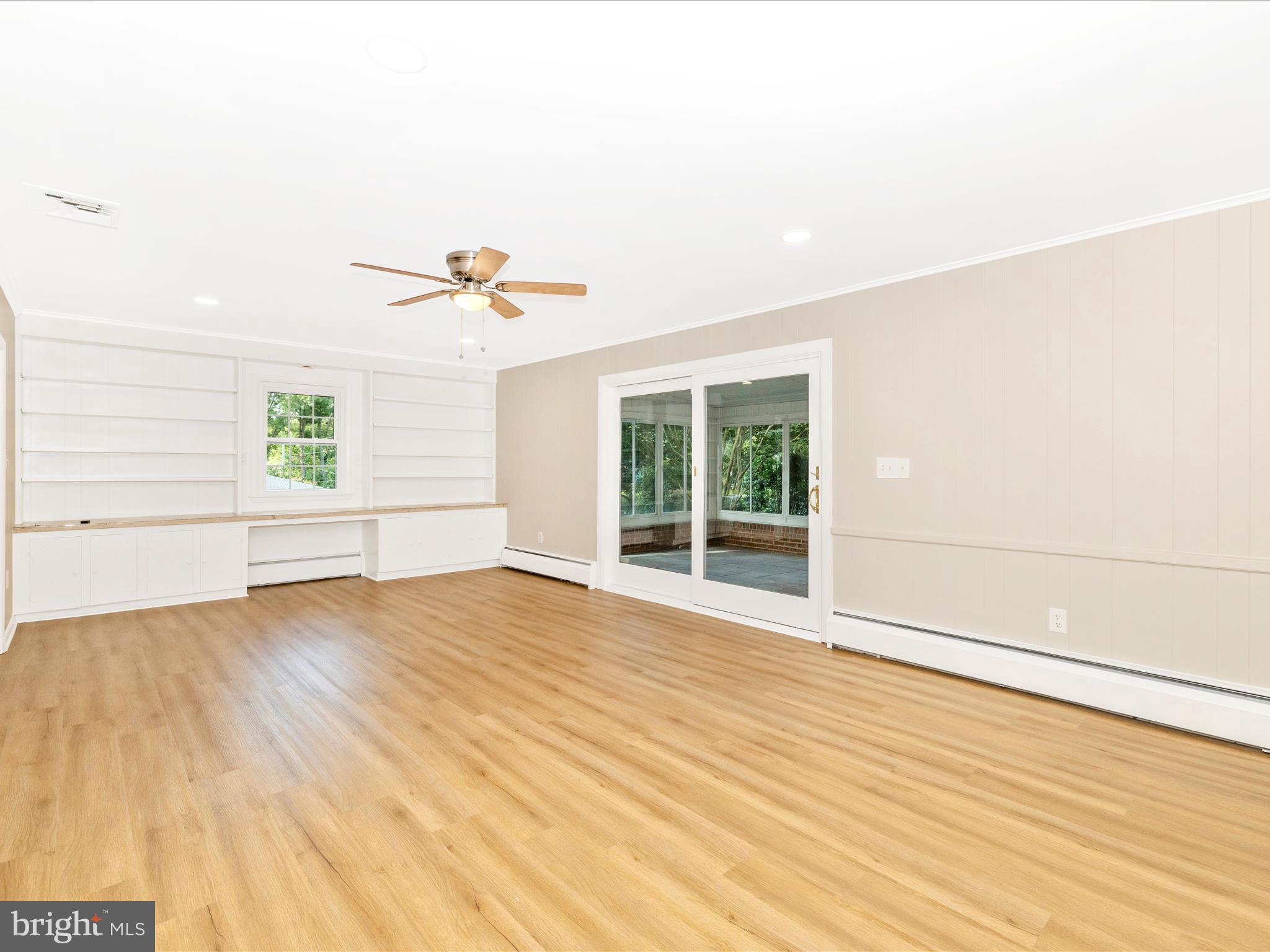3930 Chatham Road Ellicott City, MD 21042 - Photo 5 of 51 an empty room with wooden floor and windows