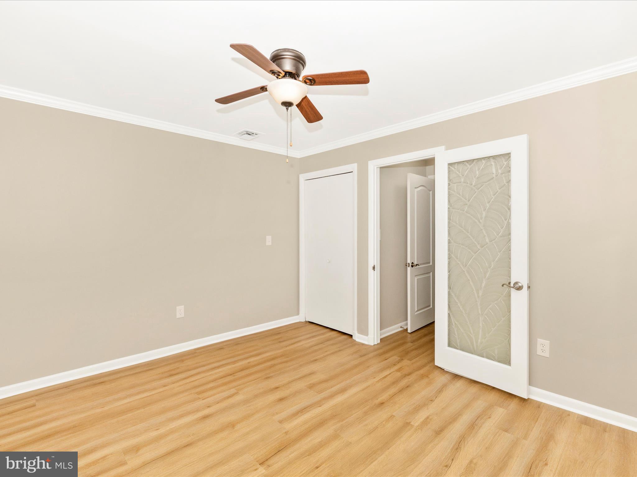 3930 Chatham Road Ellicott City, MD 21042 - Photo 10 of 51 a view of a room with wooden floor and ceiling fan
