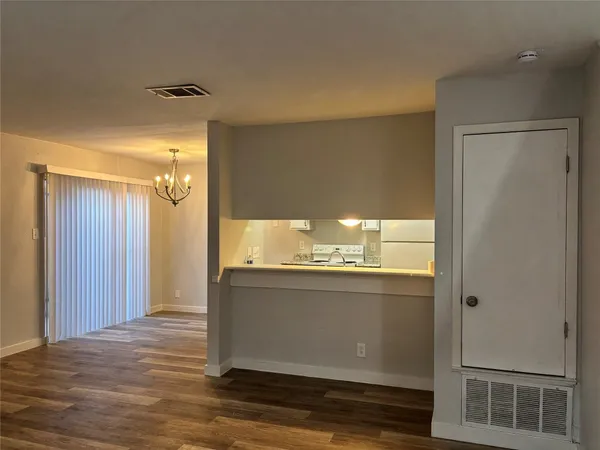 a view of an empty room and window