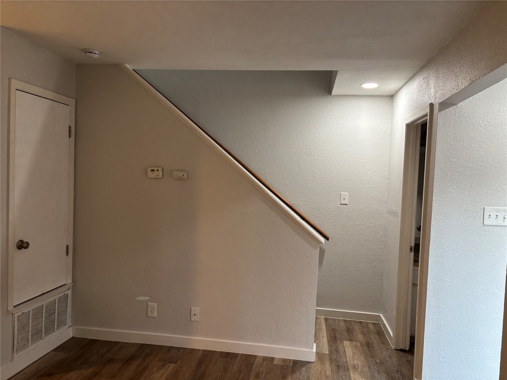 1210 Southport Drive, Unit A Austin, TX 78704 - Photo 6 of 15 a view of hallway with stairs and wooden floor