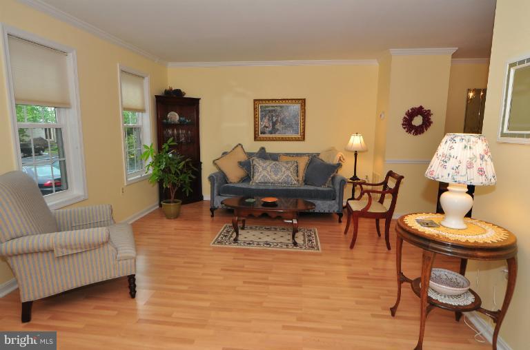11958 Sentinel Point Court Reston, VA 20191 - Photo 19 of 26 This room features Pergo floors & crown mouldings.