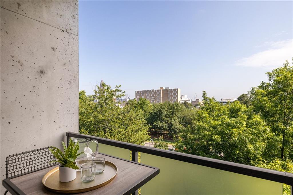 480 John Wesley Dobbs Avenue Northeast, Unit 612 Atlanta, GA 30312 - Photo 13 of 33 a view of a balcony with plants and a potted plant
