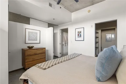 a bedroom with a bed and a dresser