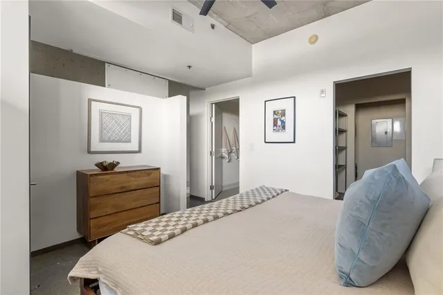 a bedroom with a bed and a dresser