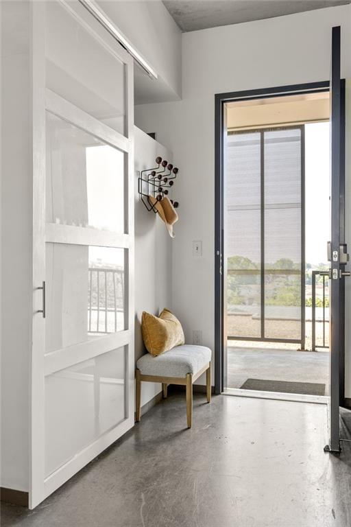 480 John Wesley Dobbs Avenue Northeast, Unit 612 Atlanta, GA 30312 - Photo 20 of 33 a living room with furniture and a window