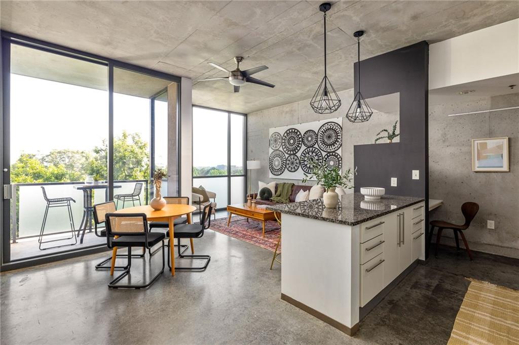 480 John Wesley Dobbs Avenue Northeast, Unit 612 Atlanta, GA 30312 - Photo 2 of 33 a living room with fireplace furniture and a large window