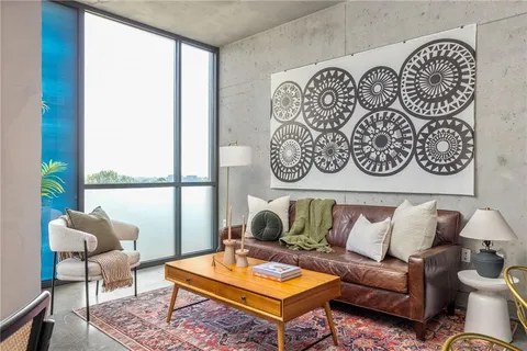 a living room with furniture and a large window