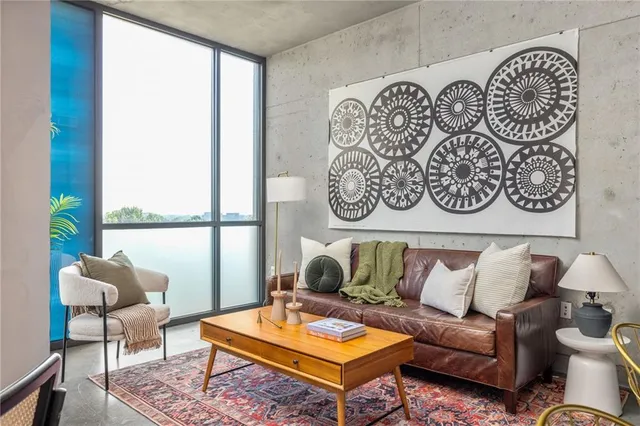 a living room with furniture and a large window